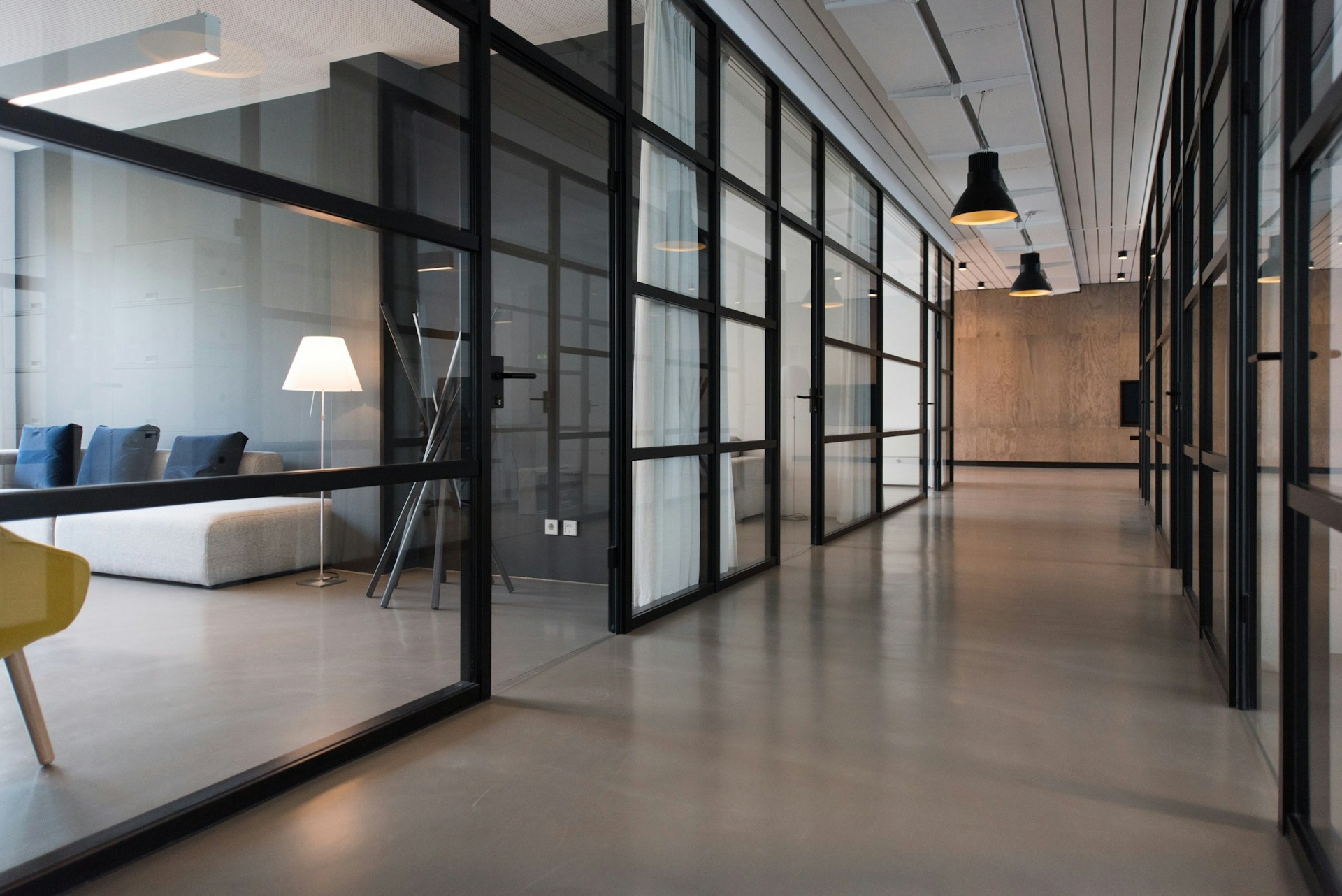 Completed workplace lighting project with warm light across collaborative spaces